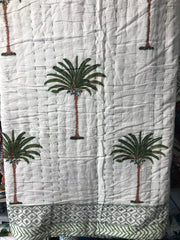 Green Palms on white, slightly padded cotton quilt